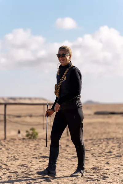 Sarah, founder and manager of Ranch des Dunes, portrait in the desert